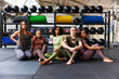 © Flamingo Images - Diverse group of fit women sitting in a gym