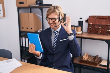 Canvas Print - Caucasian man with mustache wearing call center agent headset doing ok sign with fingers, smiling friendly gesturing excellent symbol