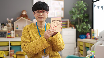 Poster - Young chinese woman preschool teacher having vocabulary lesson at kindergarten