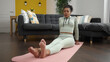 © Krakenimages.com - African american woman training feet exercise at home