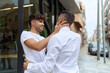 © Krakenimages.com - Two hispanic men couple smiling confident hugging each other at street