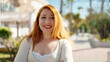 © Krakenimages.com - Young redhead woman smiling confident standing at park