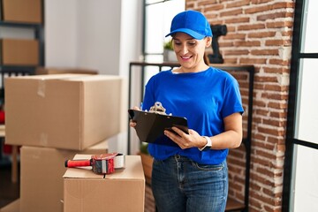 Sticker - Middle age woman moving worker writing on checklist at new home