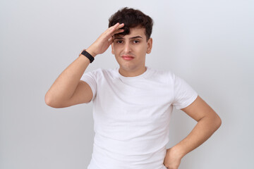 Sticker - Young non binary man wearing casual white t shirt worried and stressed about a problem with hand on forehead, nervous and anxious for crisis