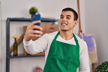 Sticker - Young man artist making selfie by the smartphone at art studio