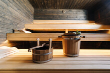 Modern Interior Of Wooden Spa Cabin. View Of Empty Finnish Sauna Room With Dry Steam. New And Fresh