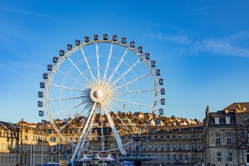 Wall Mural - Ferris wheel in Stuttgart city in front of the new castle in operation