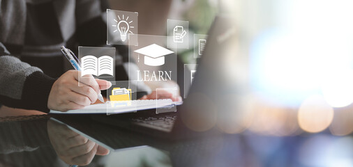 Fototapete - Concept of Online education. man use Online education training and e-learning webinar on internet for personal development and professional qualifications. Digital courses to develop new skills.