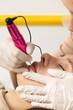 © Виктория Попова - The client during the procedure of permanent lip makeup. Permanent tattoo artist works with clients