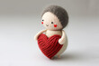 cute crochet doll holding a red yarn heart, generative AI