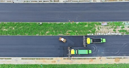 Wall Mural - Aerial view of construction site is laying new asphalt pavement. Highway construction site scene.