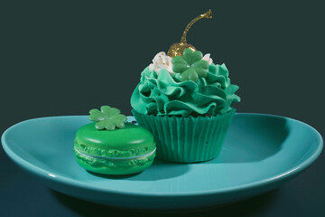 The Sweet Surprises of St. Patrick's Day: A Clover-Adorned Macaron and a Sparkling Chocolate Cupcake with Green Icing on a Dark Green Background