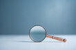 Close up magnifier glass on wooden table, the concept of searching or finding for an idea, Search for information, Find the answer.