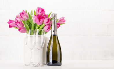 Wall Mural - Fresh pink tulip flowers and champagne