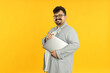 © Atlas - Concept of people, young fat man with laptop on yellow background