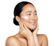 Asian woman using a skincare cream, facial makeup, and luxury cosmetics for skin wellness isolated on a png background. Happy Japanese model, facial spf lotion, and natural aesthetic dermatology.