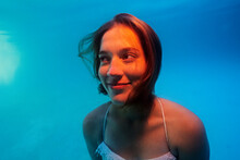 Portrait Of A Girl Underwater In A Pool.