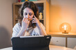 © Cavan Images - White Woman working from home