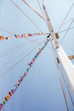 Flags Waving On Yacht Mast