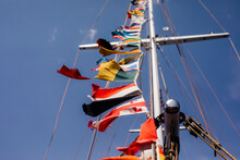 Multi Colored National Flags On Yacht Mast