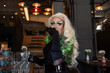 © Westend61 - Blond drag queen having vodka shot in bar