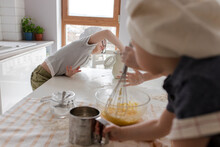 Boy Taking Flour To Prepare Dough At Home