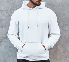 Wall Mural - Copy space hoodie design for branding clothes. young bearded man standing in white hoodie
