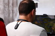 Smart posture corrector on man shoulders, lifestyle staging