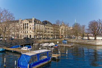 Wall Mural - Scenic view of Limmat River with Minster Bridge and the skyline of the old town of City of Zürich on a sunny winter day. Photo taken February 9th, 2023, Zurich, Switzerland.