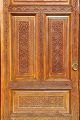 Wall Mural - Carved wooden doors with patterns and mosaics.