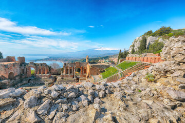 Wall Mural - Ruins of ancient Greek theater in Taormina and Etna volcano in the background.