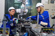 © Tongpool - Female Electronics Factory Workers use tablet pc quality checking Circuit Boards after assembly