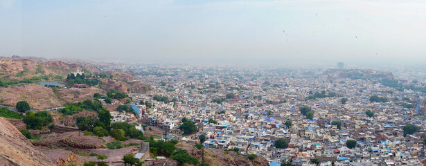 Wall Mural - Panoramic view of Jodhpur city as seen from famous Mehrangarh fort, Jodhpur, Rajasthan, India. Blue sky in background. Mehrangarh Fort is UNESCO world heritage site popular amongst tourists worldwide.