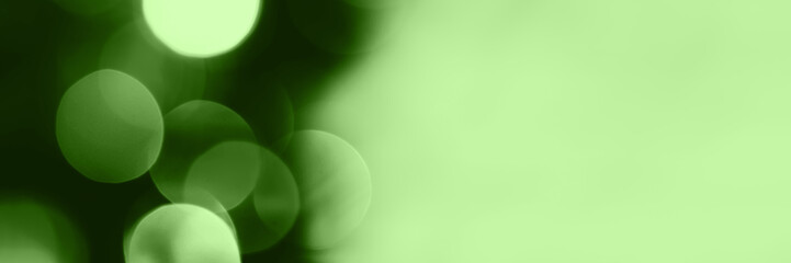 Wall Mural - Blurred lights, green background, banner texture. Abstract bokeh with soft light header. Wide screen wallpaper. Panoramic web banner with copy space for design