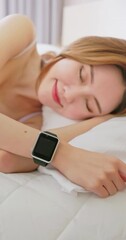 Wall Mural - Woman sleeping with smart watch