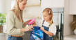 © Nina L/peopleimages.com - Backpack, kitchen and mother with child for school lunchbox, sandwich and healthy food for nutrition, wellness and development. Helping, support and care of a mom with her kid bag for back to school