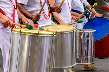 Several drummers with their musical instruments in the Carnival celebrations in the streets of Brazil