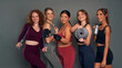 © gpointstudio - Five young women in sports clothes and gym accessories in studio shot