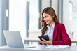 © M+Isolation+Photo - Young pretty business woman bookkeepers online consult on laptop with stock market earning and profit, tax, yearly planning, Powerful expert management complete bookkeeping service and solutions