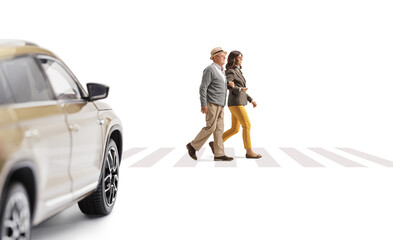 Canvas Print - Young woman and a senior man walking on a pedestrian crossing and car driving