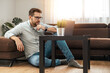© ivanko80 - Serious man working in nice modern home