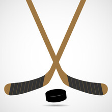 Hockey Sticks And Puck Isolated On White Background