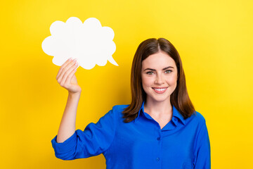 Poster - Photo of cheerful pretty lady wear blue stylish clothes hold white card isolated on yellow color background