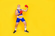 Full length size photo of professional serious confident macho boxer posing against abstract opponent wear pink belt isolated on yellow color background