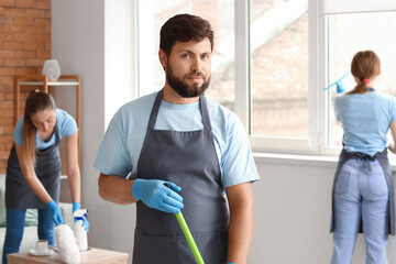 Sticker - Male janitor with mop in living room