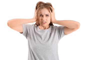 Wall Mural - Irritated young woman suffering from loud noise on white background