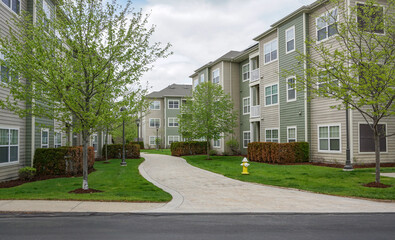 Poster - modern rental apartment buildings in community in spring