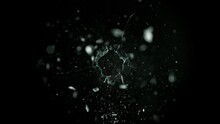 Super Slow Motion Shot Of Real Bullet Hole Glass Break Isolated On Black Background At 1000fps.