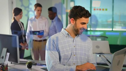 Poster - Animation of multiple digital icons over caucasian man using laptop and smiling at office