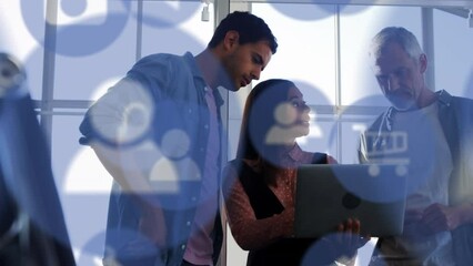 Poster - Animation of multiple digital icons over diverse colleagues discussing over a laptop at office